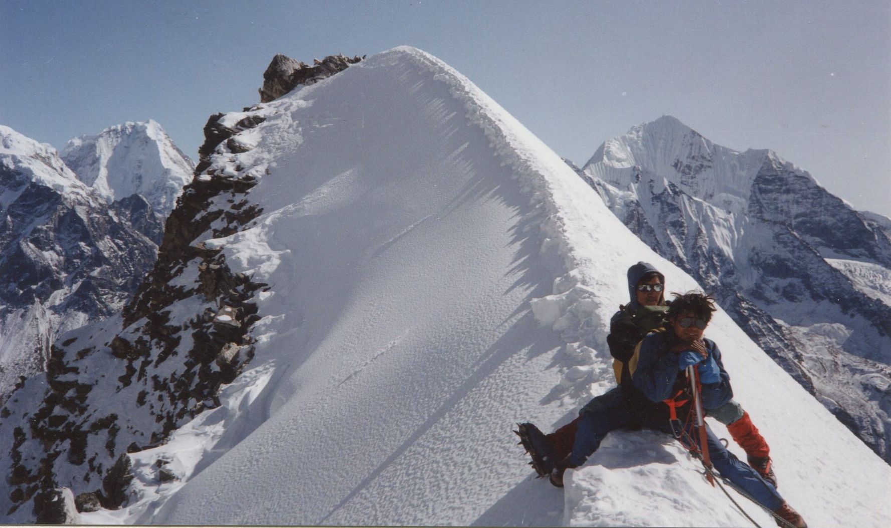 Sherpas on the summit arete of Yala Peak in the Langtang Valley