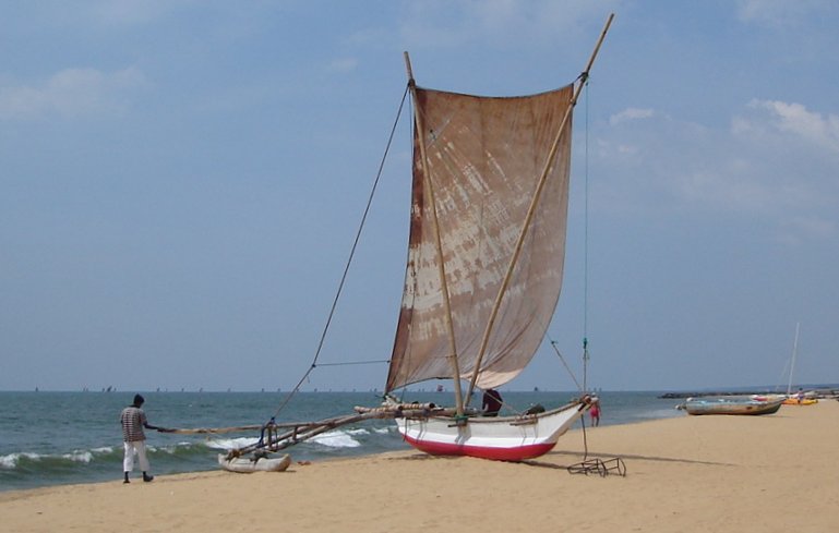 Outrigger Fishing Boat on beach at Negombo on West Coast of Sri Lanka